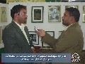 المعرض الاول لمسابقة الفنون التشكيلية / مدير المعرض مع اذاعة النجف